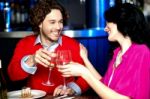 Cheers! Couple Celebrating Their Love Together Stock Photo