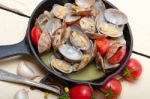 Fresh Clams On An Iron Skillet Stock Photo