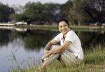 Happy Asian Woman In Public Park Stock Photo