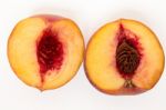 Sweet Peach Sliced Isolated On A White Background Stock Photo