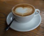 A Cup Of Coffee With Heart Pattern In A White Cup Stock Photo