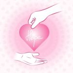 Hand Holding Pink Heart With Hope And Give Or Share To Other Han Stock Photo