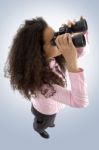 Woman Using Binoculars Stock Photo