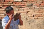 Old Man Looking Past Magnifying Glass To Old Stone Stock Photo