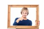 Woman Behind Wooden Frame Pointing  You Out Stock Photo