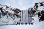 View Of Skogafoss Waterfall In Winter Stock Photo