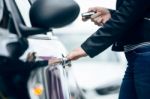 Beautiful Young Woman Opening Her Car Stock Photo