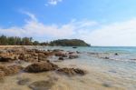 Stone On Beach With Blue Sky Stock Photo