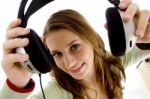 Woman Showing Headphone Stock Photo