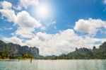 Sun Over Lake And Mountain Stock Photo