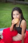 Girl Eating A Cheeseburger Stock Photo