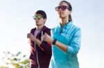 Beautiful Couple Running In The Street Stock Photo