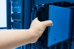 Man Fix Server Network In Data Center Room Stock Photo