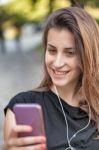 Woman Listens Music Stock Photo