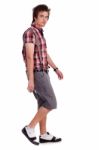 Casual Young Guy In Walking Posture Stock Photo