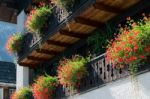 Colourful Red Geraniums On A House In Hallstatt Stock Photo