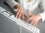 Businesswoman With Speedy Typing Stock Photo