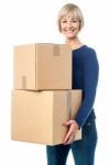 Beautiful Woman Carrying Cardboard Boxes Stock Photo