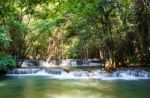 The Water Flowing Over Rocks And Trees Down A Waterfall At Huay Mae Khamin Waterfall National Park ,kanchana Buri In Thailand Stock Photo