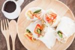 Fresh Spring Rolls On Wooden Table Stock Photo