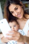 Beautiful Mother And Baby Taking A Selfie At Home Stock Photo