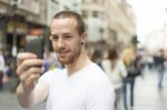 Man Taking Photo With Mobile Phone Stock Photo