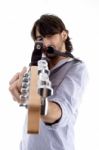 Handsome Man Pointing At You With Guitar Stock Photo