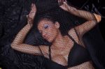 Woman Traped In Black Fishnet Stock Photo