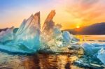 Very Large And Beautiful Chunk Of Ice At Sunrise In Winter Stock Photo