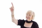 Old Female Pointing Upward Stock Photo