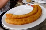 Benalmadena, Andalucia/spain - May 9 : Churros About To Be Eaten Stock Photo