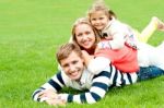 Lying Family In Outdoors Stock Photo