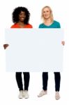 Young Women Holding Blank Board Stock Photo