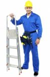 Young Worker Holding Step Ladder Stock Photo