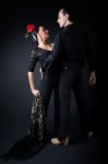 Young Flamenco Dancers In Beautiful Dress On Black Background Stock Photo