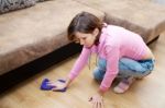 Young Woman Washing Wooden Floor With Blue Floorcloth Stock Photo