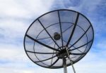 Satellite Dish With Blue Sky Background Stock Photo