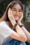 Portrait Of Thai Chinese Adult Glasses Beautiful Girl Denim Blue Bag Relax And Smile Stock Photo