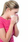 Girl Covering Her Nose With Handkerchief While Sneezing Stock Photo