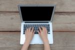 Closeup Of Business Woman Hand Typing On Laptop Keyboard Stock Photo