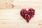 Heart Formed By Red Rose Petals On Wooden Background Stock Photo