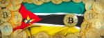 Bitcoins Gold Around Mozambique  Flag And Pickaxe On The Left.3d Stock Photo