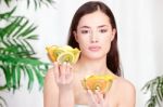 Woman Holding Bowls Full Of Fruit Stock Photo