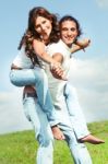 Young Male Carrying Woman Stock Photo