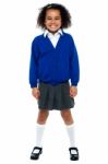 Full Length Portrait Of A Joyous African School Girl Stock Photo