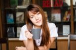 Portrait Of Thai Adult Student University Uniform Beautiful Drinking Coffee Stock Photo