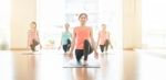 Asian Woman Doing Yoga Indoors Stock Photo