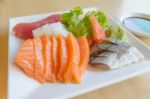 Salmon And Other Fish Raw With Wasabi And Sauce On Table Wood In Stock Photo