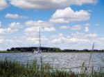 Yacht Cruising Down The River Alde Stock Photo