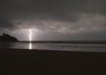 Incredibly Sharp Lightning With Branches Hitting The Ocean With Stock Photo